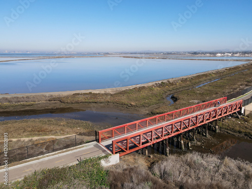 Aerial view of Small bridge on Otay River next to San Diego Bay National Refuger in Imperial Beach, San Diego, California, USA