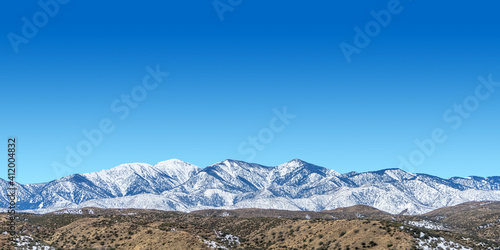 Snow on the San Bernardino Mountains with blue sky