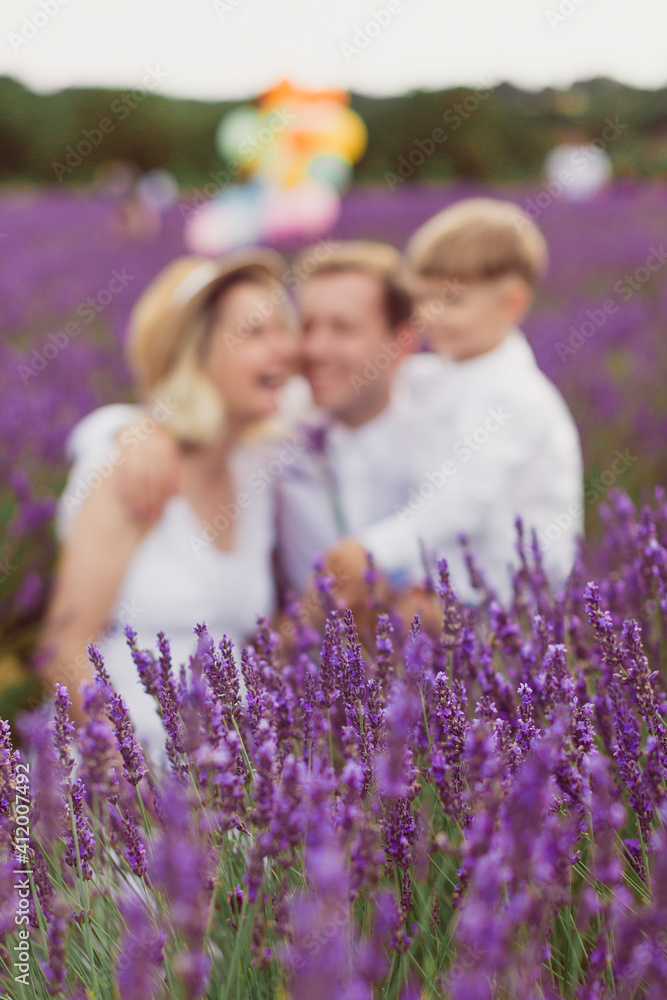 blurry photo of the happy family in the lavender field blurry photo of the happy family in the lavender field