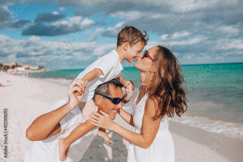 Happy family on the beach. Family vacation on the sea coast