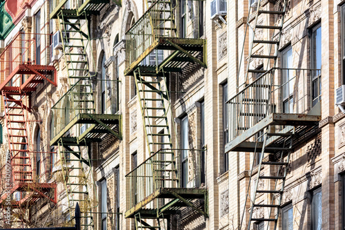 Old brick apartment buildings with colorful fire escapes in the East Village neighborhood of New York City