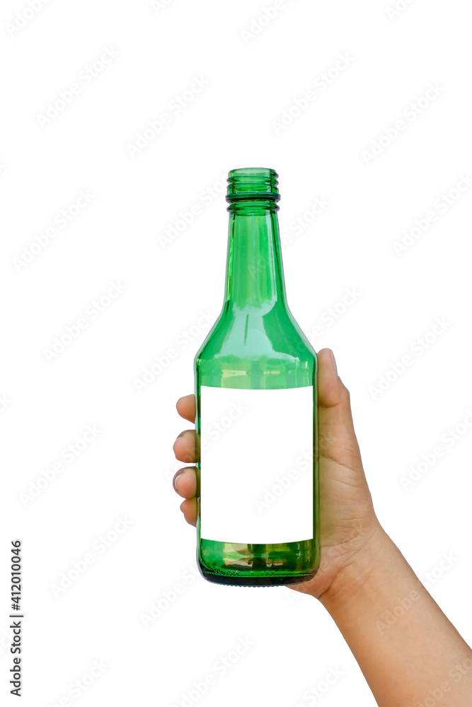 Hand holding an empty green glass bottle with a text space isolated on a white background with the clipping path. Hand holding an empty green glass bottle with a text space isolated on a white background with the clipping path.