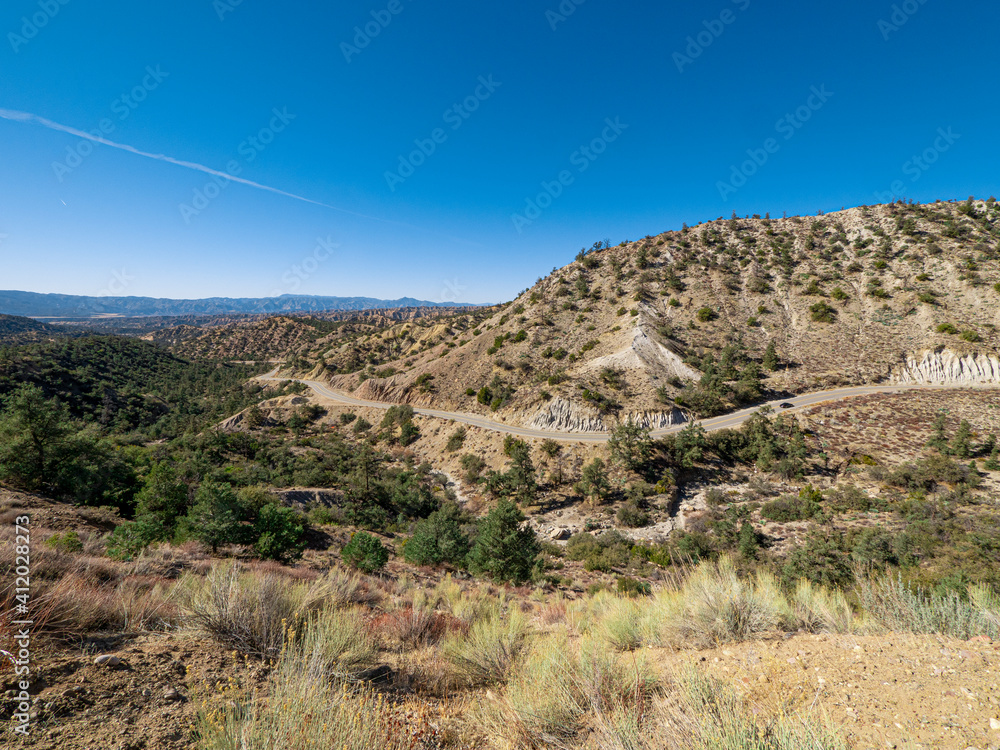 Wide angle view of California Mountain Landscape with Winding Road Daytime Wide angle view of California Mountain Landscape with Winding Road Daytime