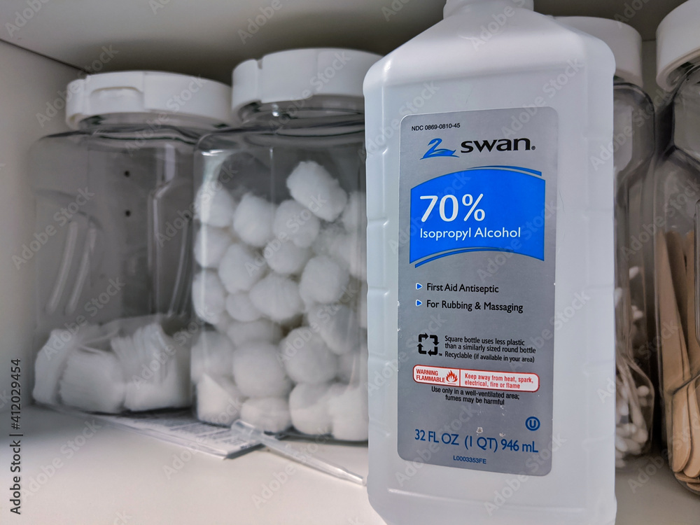 Seattle, WA / USA - circa March 2020: Isopropyl alcohol and hydrogen  peroxide in a medical cabinet with cotton balls. Stock Photo | Adobe Stock