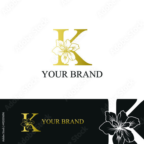 Golden Luxury Initial letter K with February Iris flower for cosmetic, Jewelry, boutique, hotel, resort, florist, beauty spa salon logo concept vector
