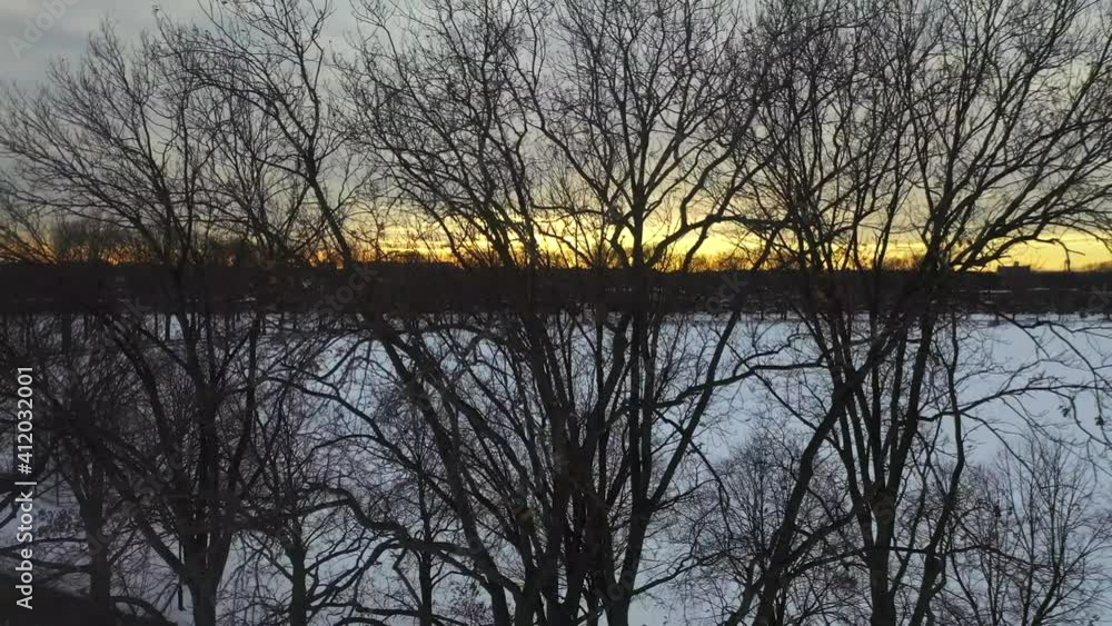 Aerial Sunset View of a Snow-Covered Park Aerial Sunset View of a Snow-Covered Park