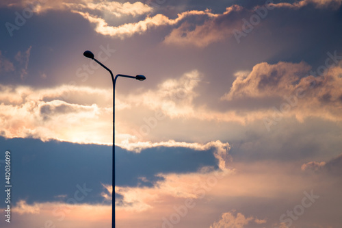 Street lamp on evening blue sky and clouds background and copy space