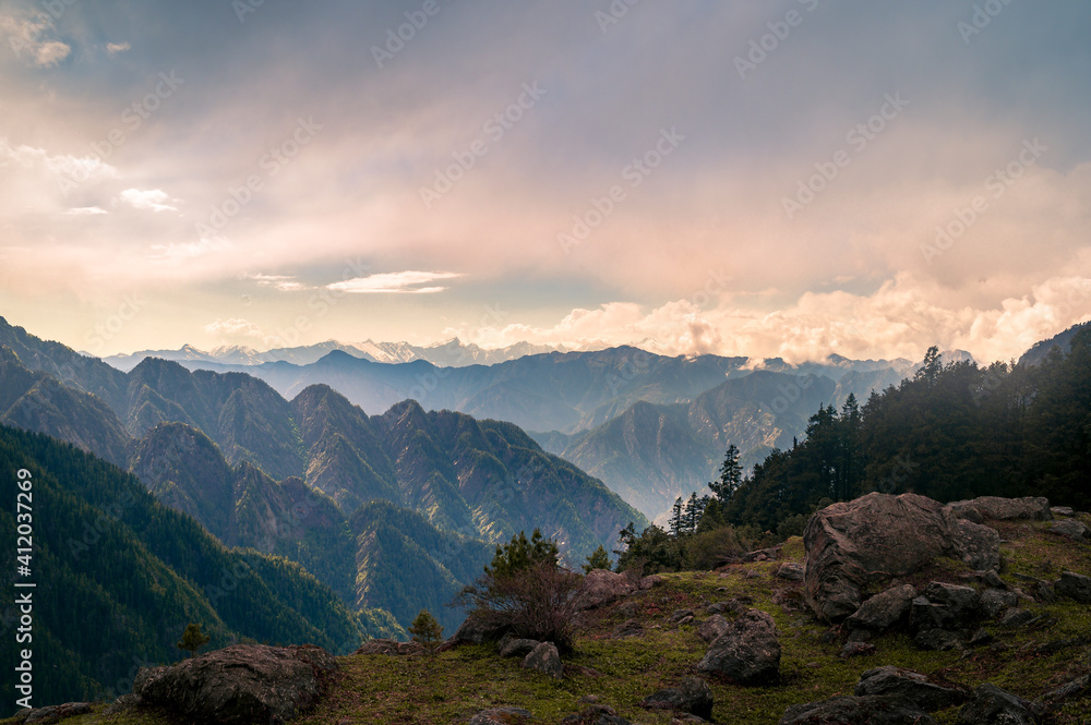 Sunset in the mountains. This is the view of Himalayas peaks, alpine landscape from the trail of Sar Pass trek Himalayan region of Kasol, Himachal Pradesh, India.	