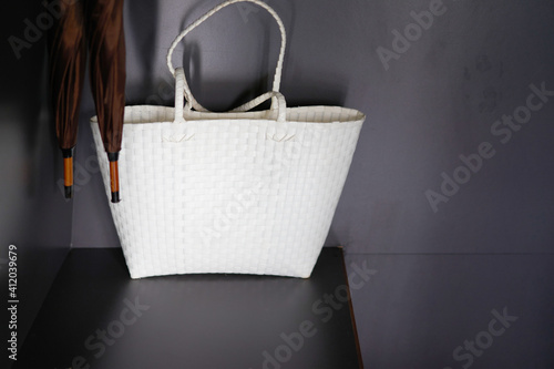 white beach bag in hotel closet