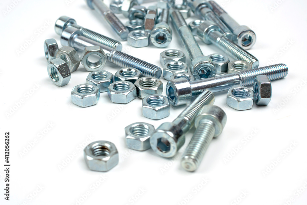 bolts and nuts in silver metal on white background bolts and nuts in silver metal on white background