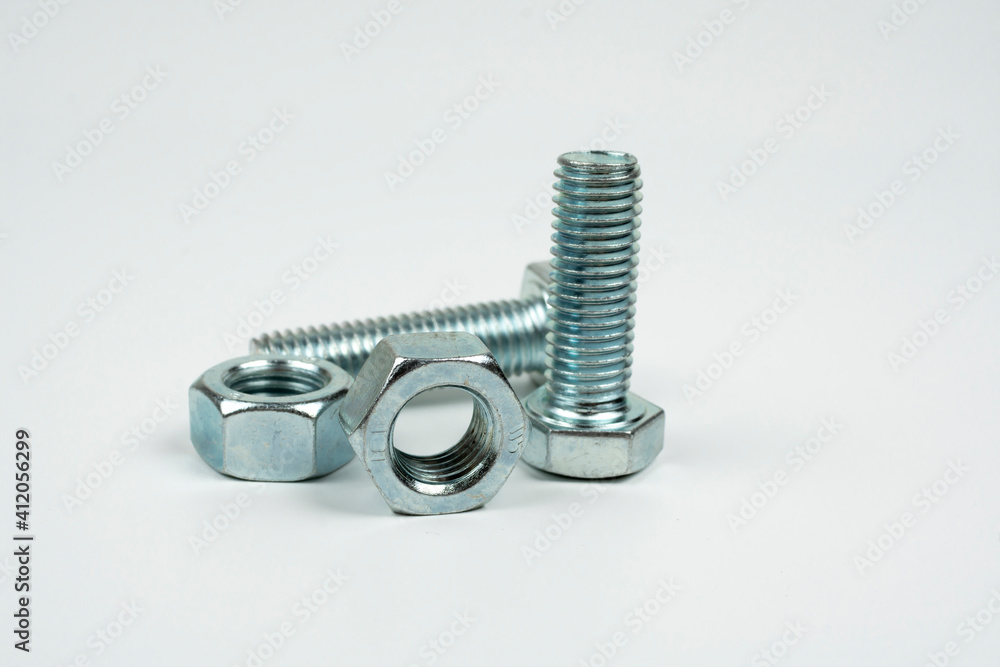 bolts and nuts in silver metal on white background bolts and nuts in silver metal on white background