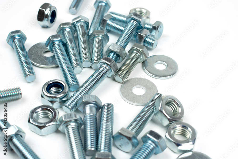 bolts and nuts in silver metal on white background bolts and nuts in silver metal on white background