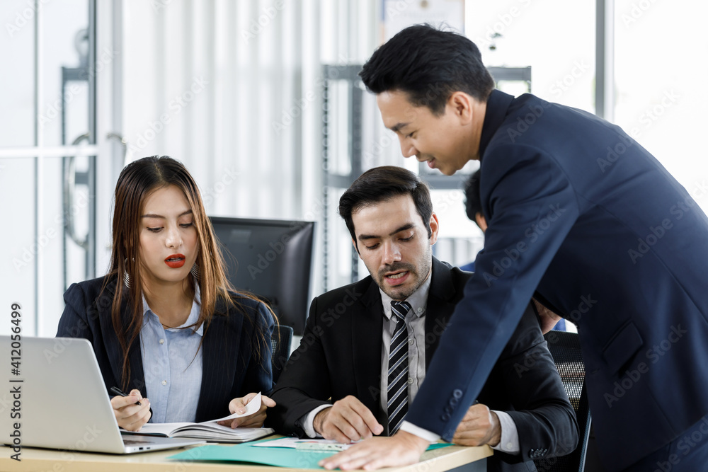 Diverse group of businesspeople working together in office. Diverse group of businesspeople working together in office.