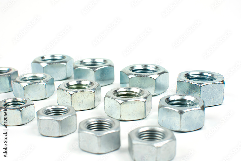 large metal nuts on a white background close up large metal nuts on a white background close up