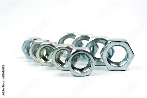 large metal nuts on a white background close up