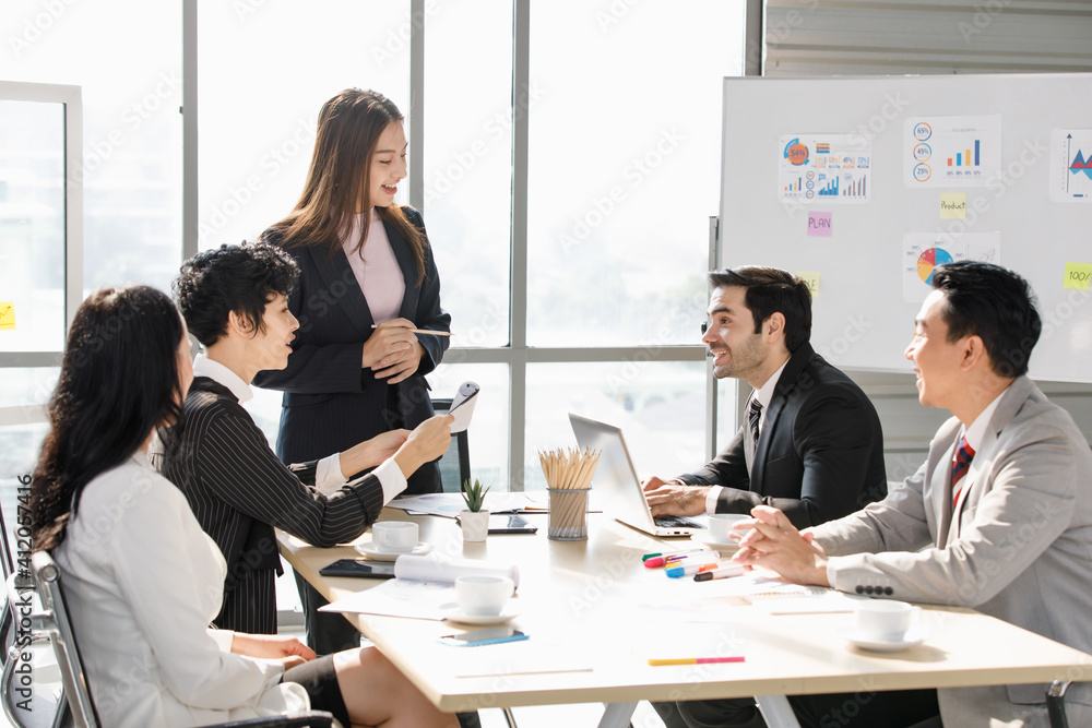 A Group of diverse businesspeople, Asan and Caucasian, make a conference together at the desk. Idea for good team at workplace A Group of diverse businesspeople, Asan and Caucasian, make a conference together at the desk. Idea for good team at workplace