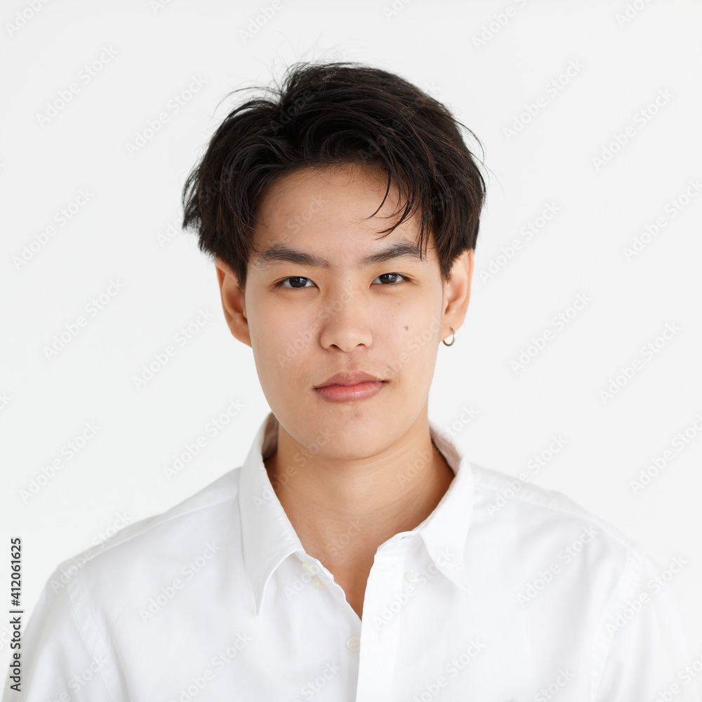 Portrait of a handsome tomboy, a girl who loves to be a man, on white background Portrait of a handsome tomboy, a girl who loves to be a man, on white background