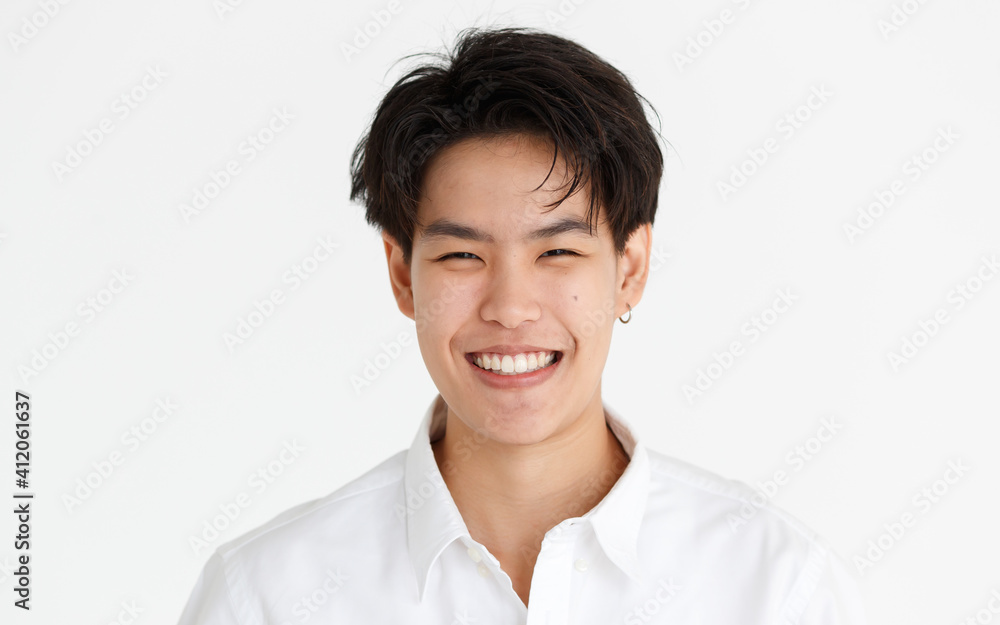 Portrait of a handsome smile face tomboy, a girl who loves to be a man, on white background Portrait of a handsome smile face tomboy, a girl who loves to be a man, on white background