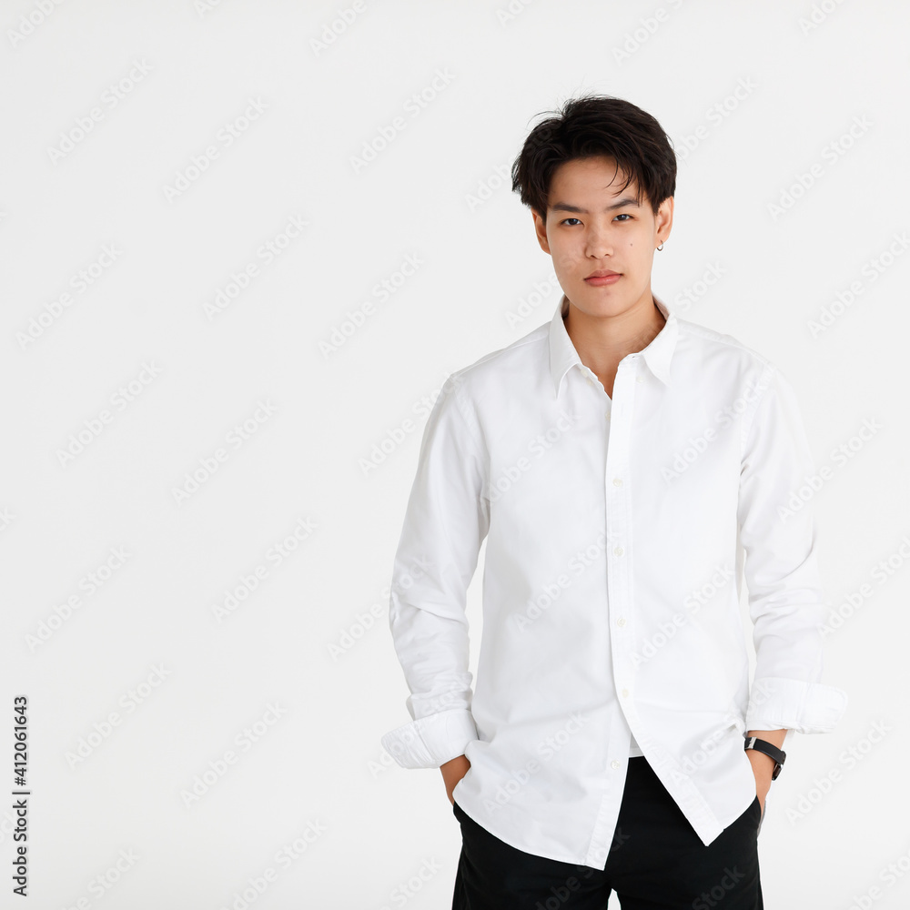 Half length shot portrait of a handsome good looking tomboy, a girl who loves to be a man, on white background Half length shot portrait of a handsome good looking tomboy, a girl who loves to be a man, on white background