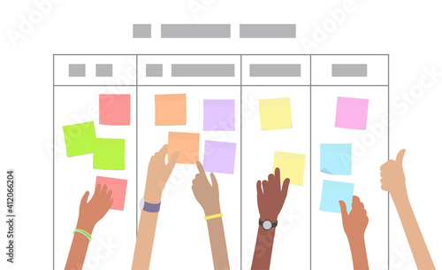 Multiracial developer team working on scrum sprint board