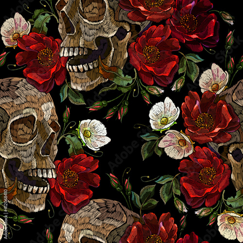 Embroidery human skull, red roses and white flowers. Seamless pattern. Fashion clothes template and t-shirt design. Dark gothic art. Halloween art. Medieval style