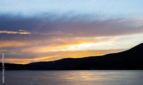 Columbia River at sunset, looking across the state border from Oregon to Washington.