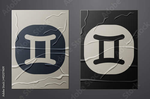 White Gemini zodiac sign icon isolated on crumpled paper background. Astrological horoscope collection. Paper art style. Vector.