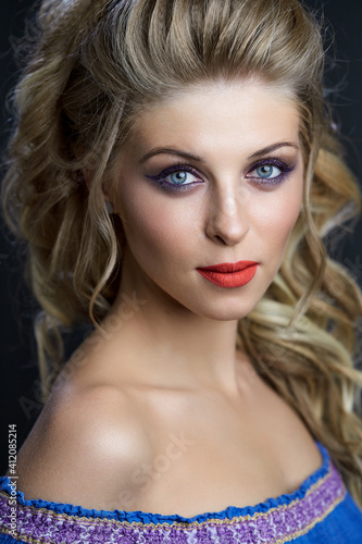 Fototapeta Naklejka Na Ścianę i Meble -  Close-up portrait of caucasian young woman with beautiful blue eyes