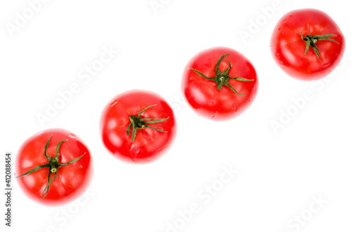 Wet red ripe tomatoes on white backgroun. © ArtCookStudio