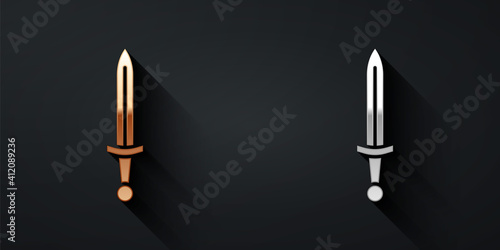 Gold and silver Medieval sword icon isolated on black background. Medieval weapon. Long shadow style. Vector.