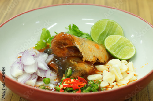 spicy canned sardine salad with lime, chili, garlic and onion