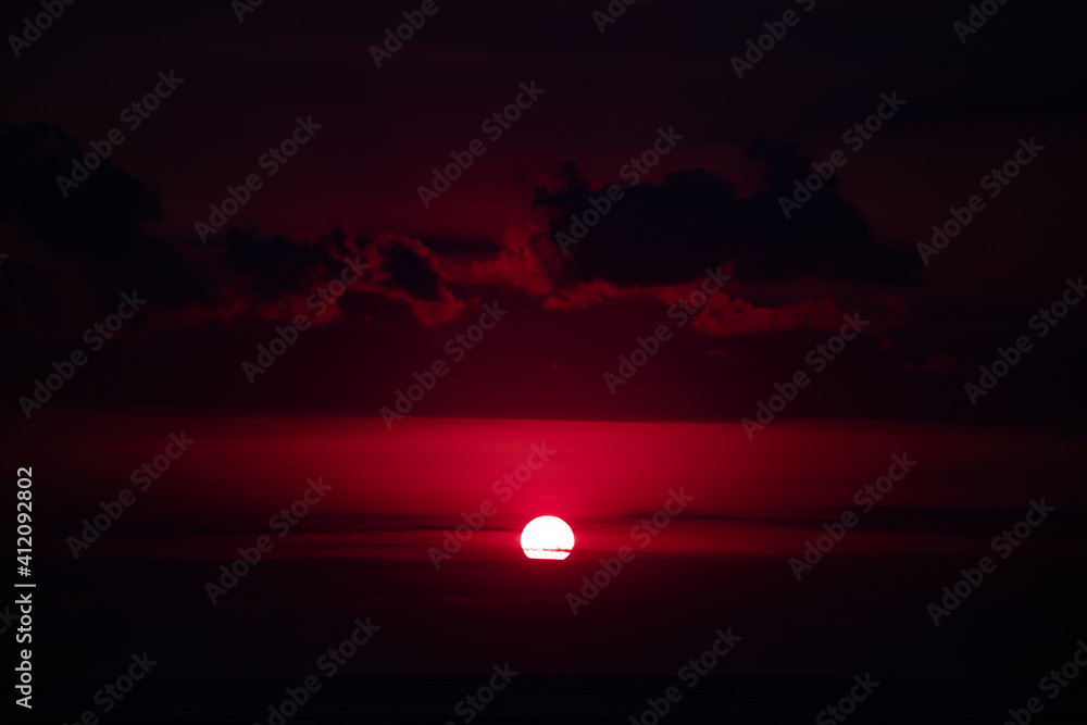 Sunrise / sunset over the ocean and horizon in golden colors. Sunrise / sunset over the ocean and horizon in golden colors.