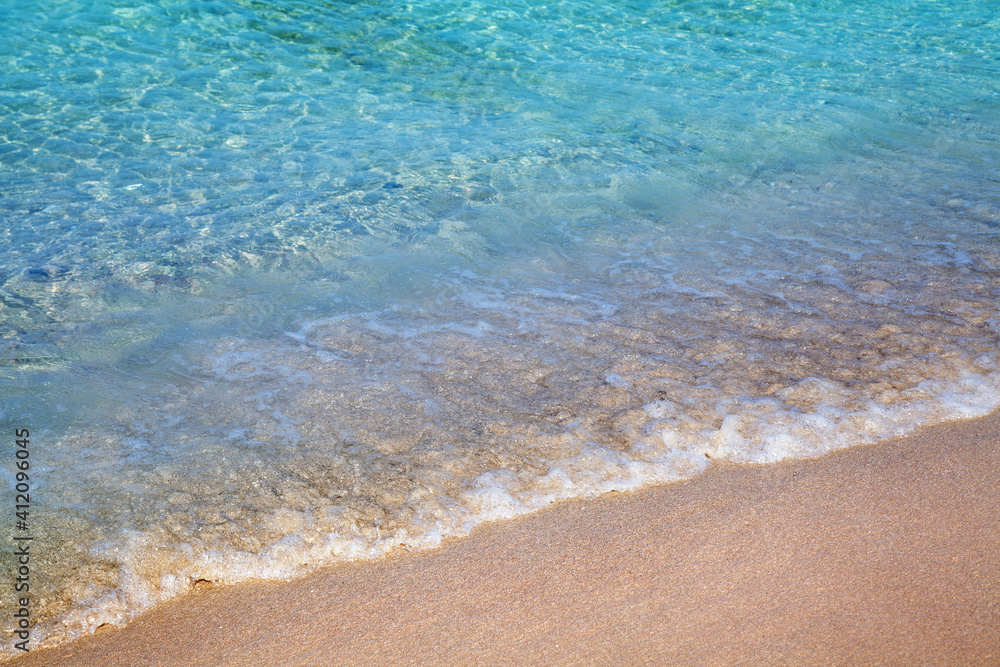 View of seascape sandy beach. Sand and water. Calm sea with clear water