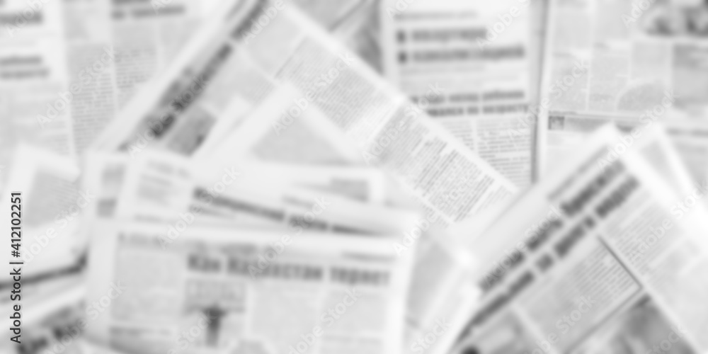 Obraz premium Abstract blurred image of old newspapers. Media news concept. Panoramic image. ..