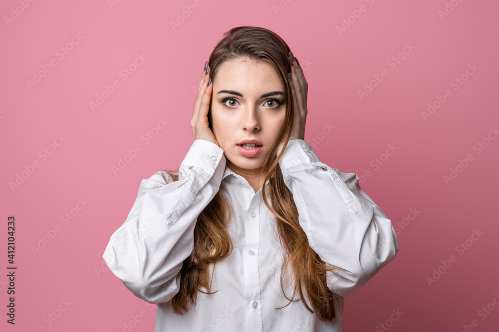 Portrait of concerned brunette girl, grab head and panicking, staring alarmed, feel scared and nervous dont know what do Portrait of concerned brunette girl, grab head and panicking, staring alarmed, feel scared and nervous dont know what do