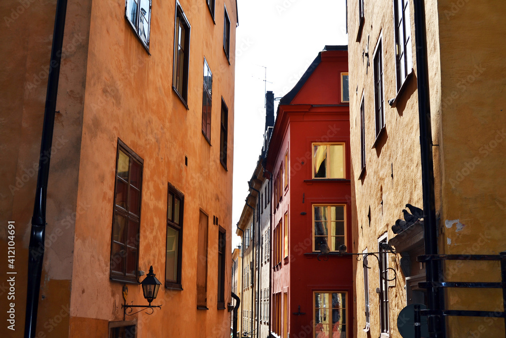 Narrow street with colorful buildings in the Old Town (Gamla Stan), Stockholm center, Sweden