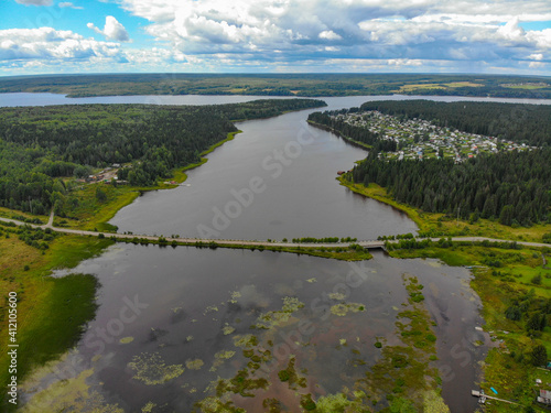 Aerial view of a small bridge over the river in Omutninsk (Kirov region, Russia)