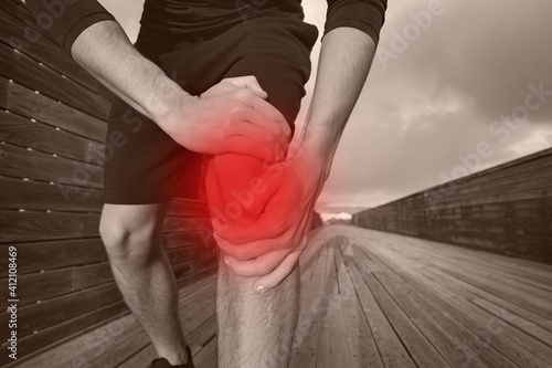 Runner suffering from knee injury and pain. Meniscus Injury, dislocated knee, tendonitis