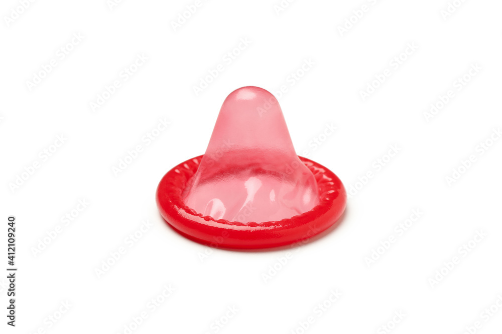 Single red condom isolated on white background Single red condom isolated on white background