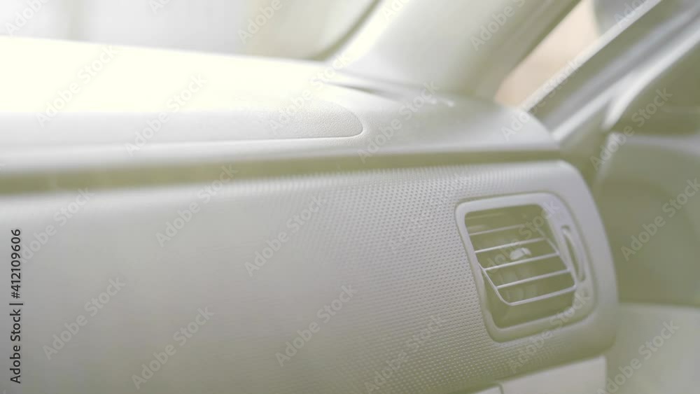 Warming hands near the car's air deflector in winter Warming hands near the car's air deflector in winter
