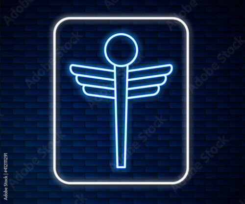 Glowing neon line Caduceus snake medical symbol icon isolated on brick wall background. Medicine and health care. Emblem for drugstore or medicine, pharmacy. Vector.