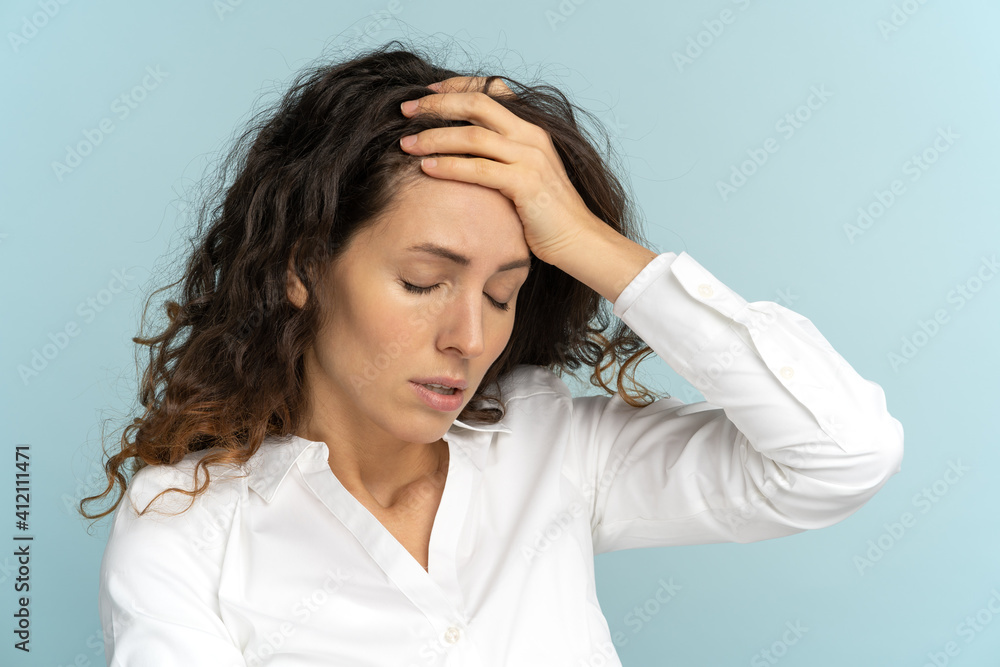 Studio portrait of tired frustrated business woman or office worker touching her forehead, has emotional burnout, exhausted by long work during hot weather in the office, isolated. Mental health. Studio portrait of tired frustrated business woman or office worker touching her forehead, has emotional burnout, exhausted by long work during hot weather in the office, isolated. Mental health.