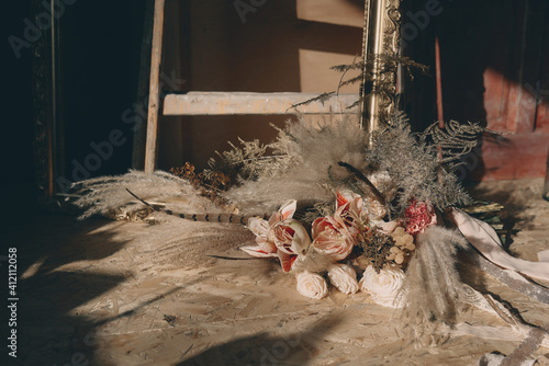 Boho style wedding bouquet in shades of brown, beige and white.