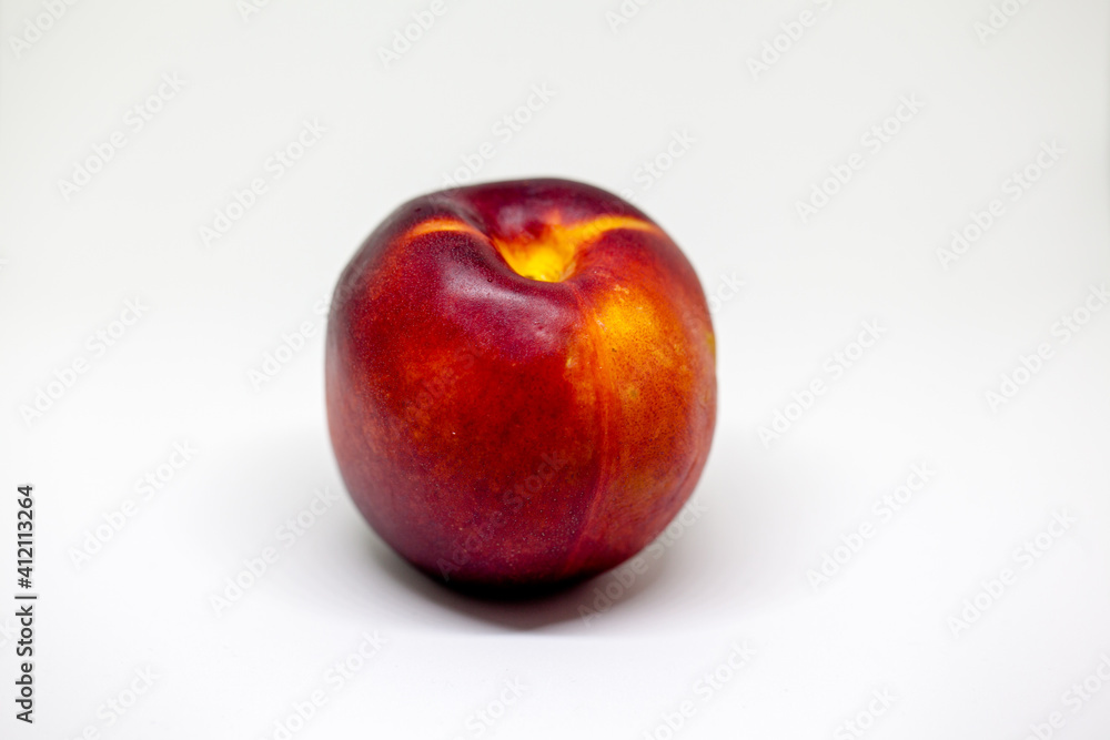 Fresh ripe nectarines, peach fruit, isolated in white Fresh ripe nectarines, peach fruit, isolated in white