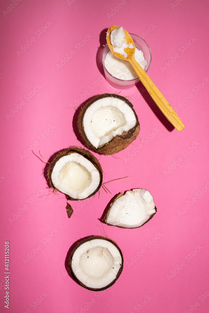 Half of coconuts isolated on color background. Coconut cream. Top View. Flat lay. Half of coconuts isolated on color background. Coconut cream. Top View. Flat lay.