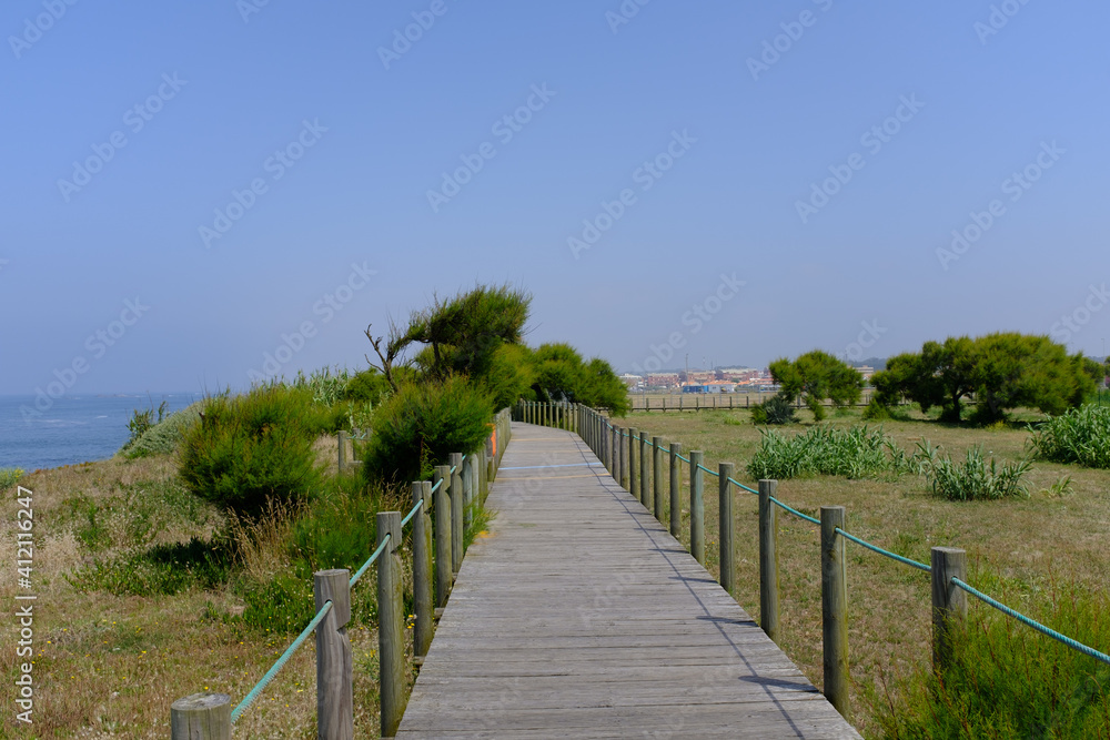 wooden path along sea in portugal