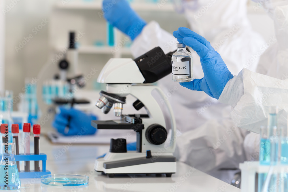 Researchers are developing a vaccine for Covid-19 virus protection in the biological laboratory, selective focus Researchers are developing a vaccine for Covid-19 virus protection in the biological laboratory, selective focus