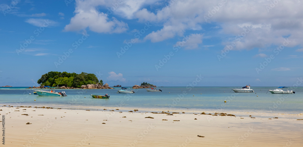View of Chauve Souris Relais island from Cote D'or beach on Praslin Island, Seychelles
