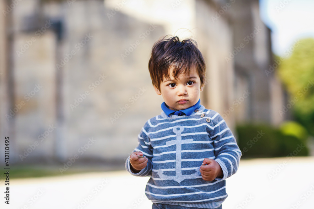 Portrait of a little eastern handsome baby boy playing outdoor in the park Portrait of a little eastern handsome baby boy playing outdoor in the park
