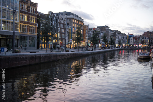 Amsterdam canal with houses on the side © Agata